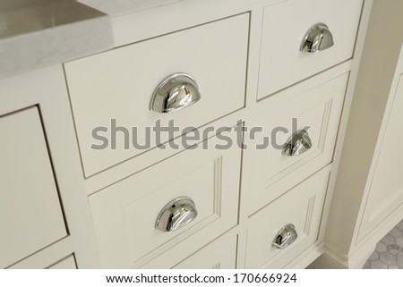 Horizontal Shot Of White Drawers With Chrome Handles In Master Bathroom/Beautiful Drawers In Upscale Master Bathroom