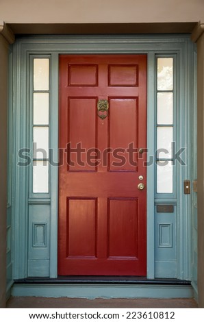 Red Door with Blue Door Frame and Windows
