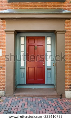 Red Front Door with Blue Door Frame and Windows on Tan Building with TIle