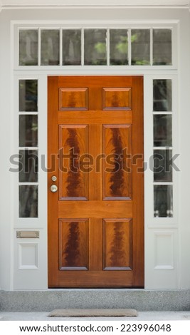 Natural Wood Front Door with White Door Frame and Windows