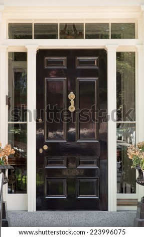 Black Front Door with White Door Frame and Windows