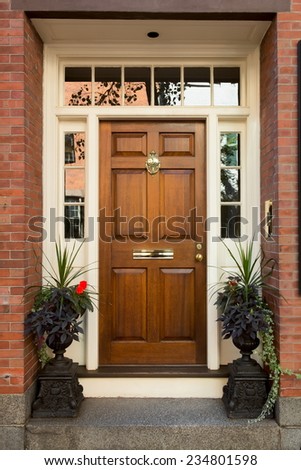 Warm Natural Wooden Door with Surrounding White Door Frame and Windows