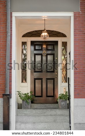 Regal Black Front Door with Lunette Under White Portico