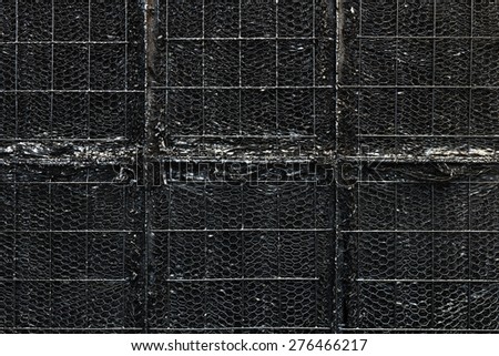 Close -up of Industrial Paint Booth with Black Paint Covering