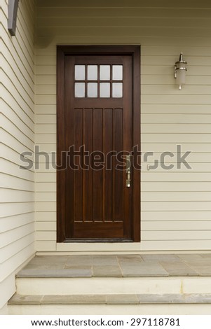 Wooden Front Door of a craftsman style home.