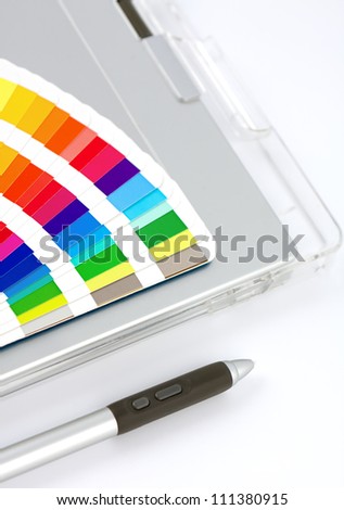 Color Chart, Graphics Tablet And Pen, close-up view on white with feint shadow.