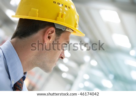 handsome young man architect on a building construction site