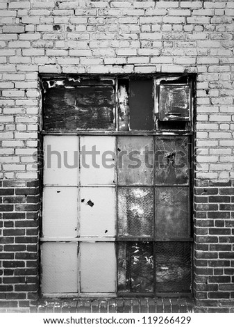 Old windows in a New York warehouse are closed up and painted over which creates a nice textured background.