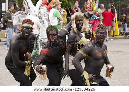 SEATTLE, WA - JUNE 16, 2012: A performance troupe gets in the mood to perform before the 2012 Annual Summer Solstice Parade in Seattle on June 16, 2012. The parade celebrates the start of summer.