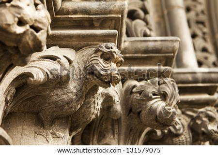 A series of dragon gargoyles carved in stone line the main entrance door to St. Giles Cathedral in Edinburgh, Scotland.