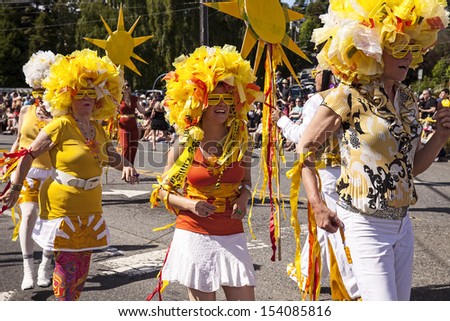 SEATTLE, WA - JUNE 22, 2013: Unidentified dancers in the Soul Train ensemble dance in the 2013 Fremont Summer Solstice Parade in Seattle on June 22, 2013. The parade celebrates the start of summer.