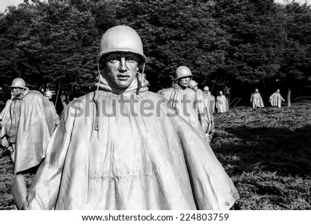 WASHINGTON DC, USA - JULY 17, 2014: A bronze figure of platoon leader leads his squad through the Korean War Memorial in Washington, DC. (Scanned from black and white film.)