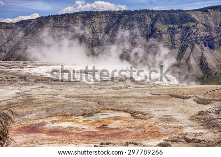 Canary Springs is an active hot spring on the main terrace of Mammoth Hot Springs in Yellowstone National Park. The travertine marble is formed from calcium carbonate from the minerals in the water.