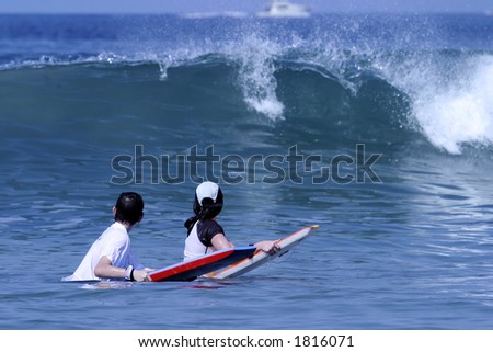 Waiting For The Wave with two children surfing