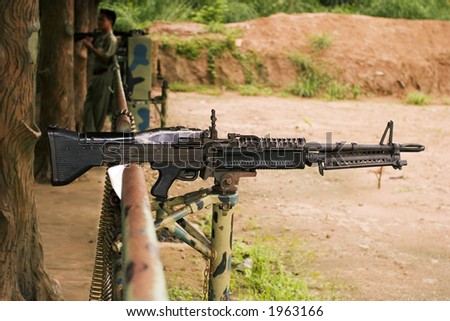 An M-60 machine gun, loaded with live ammunition, on a firing range in Vietnam.