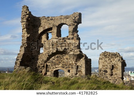 The medieval ruins of St. Anthony\'s chapel in Holyrood Park overlooking the city of Edinburgh.