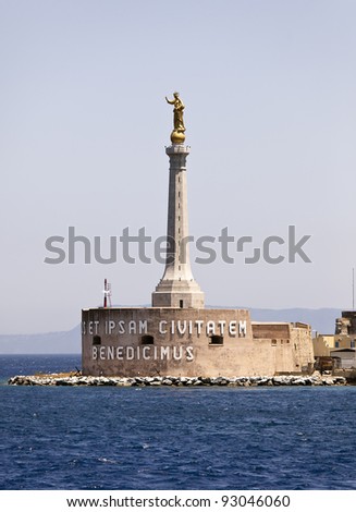 La Madonna Della Lettera is a 20 ft high golden statue on a tall pedestal that watches over the harbor of Messina on Sicily in Italy. The Latin inscription translates to 