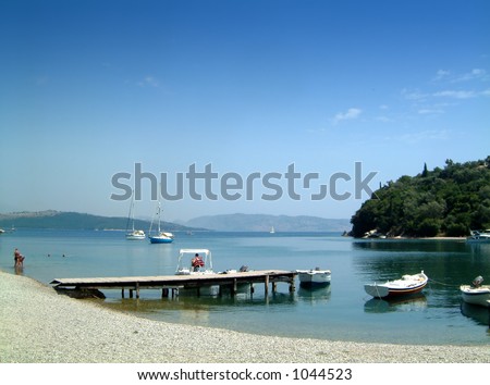 Agios Stephanos, Corfu - a popular place to tie up boats. Albania can be seen in the distance