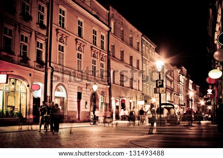 stylized photo of the city\'s old street in the night