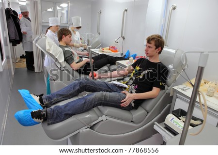 MOSCOW, RUSSIA - APRIL 20: The City Blood Service makes a promo action for donorship popularization. Volunteers donate blood, April 20, 2010, Moscow, Russia.
