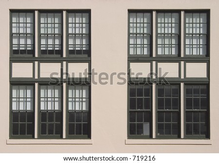 Large windows on the side of an old industrial building.