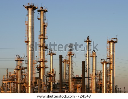 The towers and piples of an oil refinery.