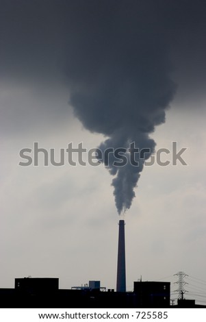 A smokestack belches pollution from a power plant.
