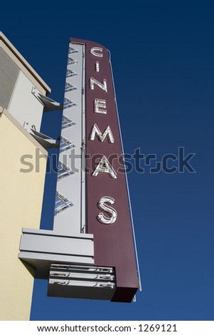 A retro Cinemas sign, outside of a movie theater.