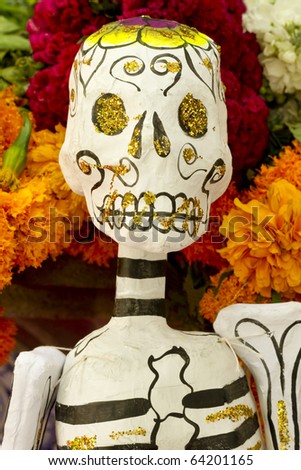 Paper skeleton with flowery background from Mexico day of the day holiday Dia de los Muertos.