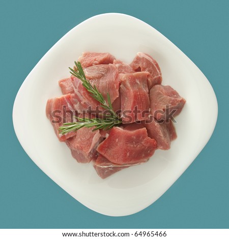 Raw beef stew meat from the shank in cubes top view shot with studio lights and macro100mm.