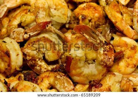 Fried Garlic Shrimp  with caramelized onion and garlic seen close up. Studio lights and 50mm 2.8 lens.