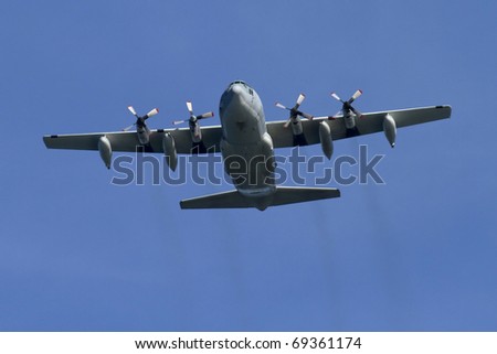 Marine Cargo plane seen approaching. Shot from below. All IDs removed.