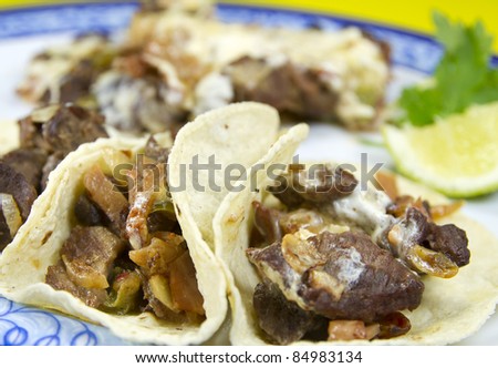 Mexican Beef Dish known as Alambre made with beef, onion, bacon, chili, cheese.