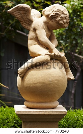 A statue of Cupid in a Garden