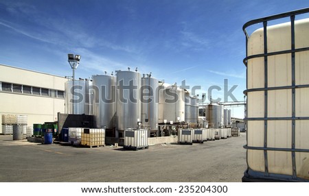 exterior of a chemistry factory with tanks and pipes