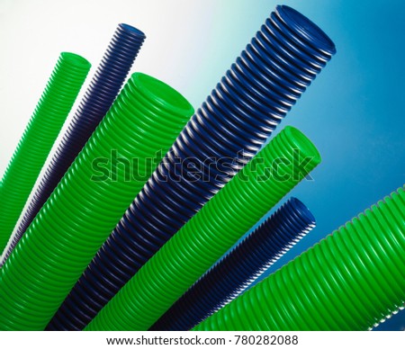 green and blue plastic tubes