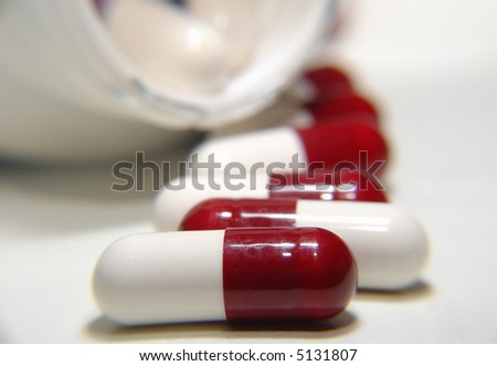 Red and white Medication pills out of the box