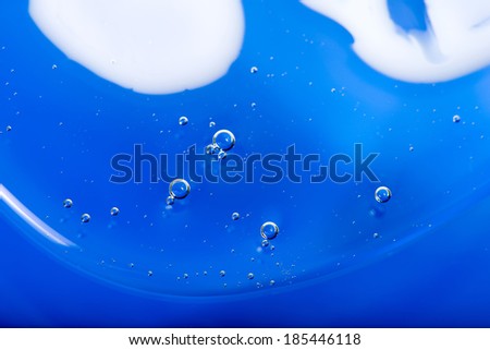 Abstract blue background from the liquid with air bubbles closeup