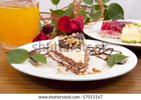 Sweet chocolate dessert with nuts in shape of triangle with juice