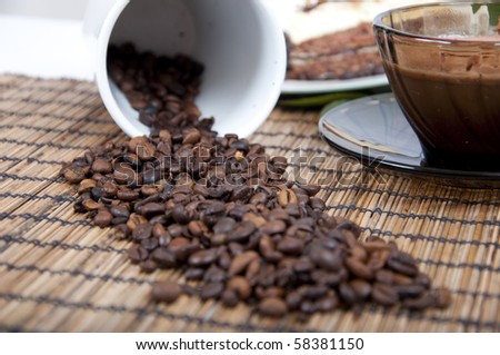 Chocolate dessert with coffee bean and coffee and rose on background