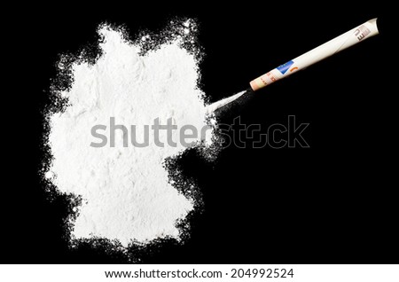 A powder drug like cocaine in the shape of Germany with a rolled money bill.(series)