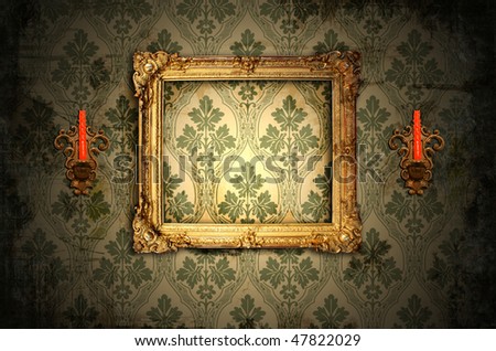 wooden frame and gold candlesticks on the wall
