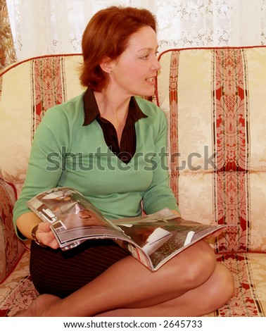 Reading her favorite magazine middle aged Lady