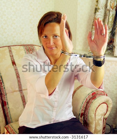 stock photo Woman handcuffed and ready from her imprisoning