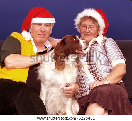 Christmas couple with their pet sharing love