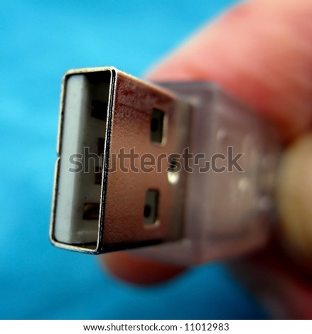 Usb connector held by a human hand