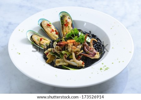Spicy black spaghetti with seafood