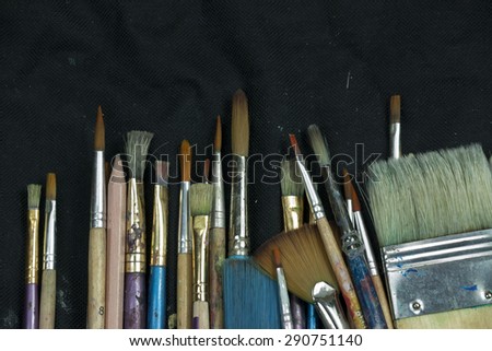 Artist paint brushes in thier pouch read for use