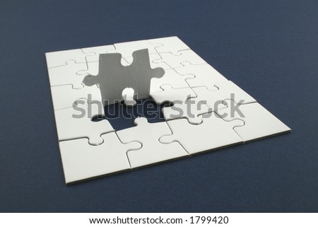 jigsaw puzzle with last piece to be placed