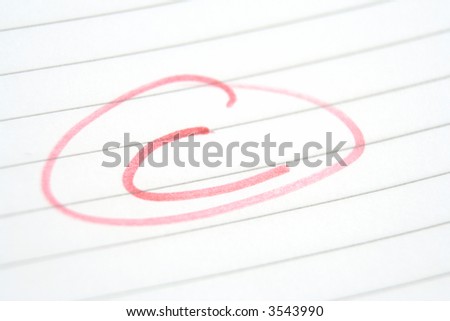 Teachers marking in red pen